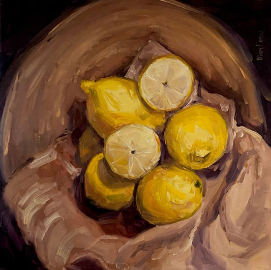 Lemons in bowl with cloth