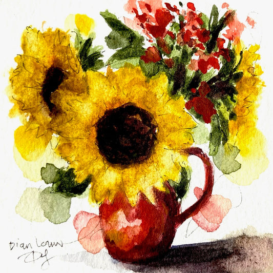 Sunflowers in small red vase